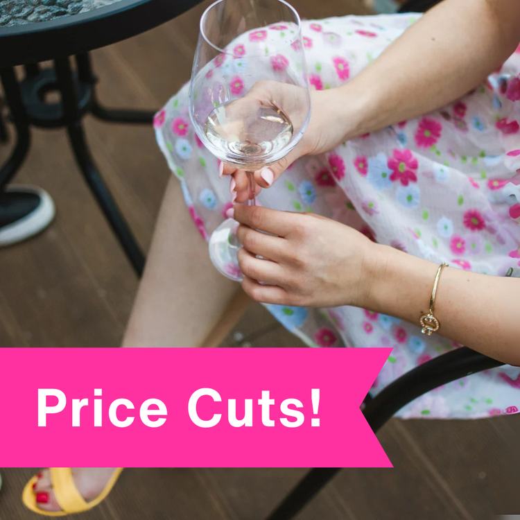 Women in Floral dress drinking white wine