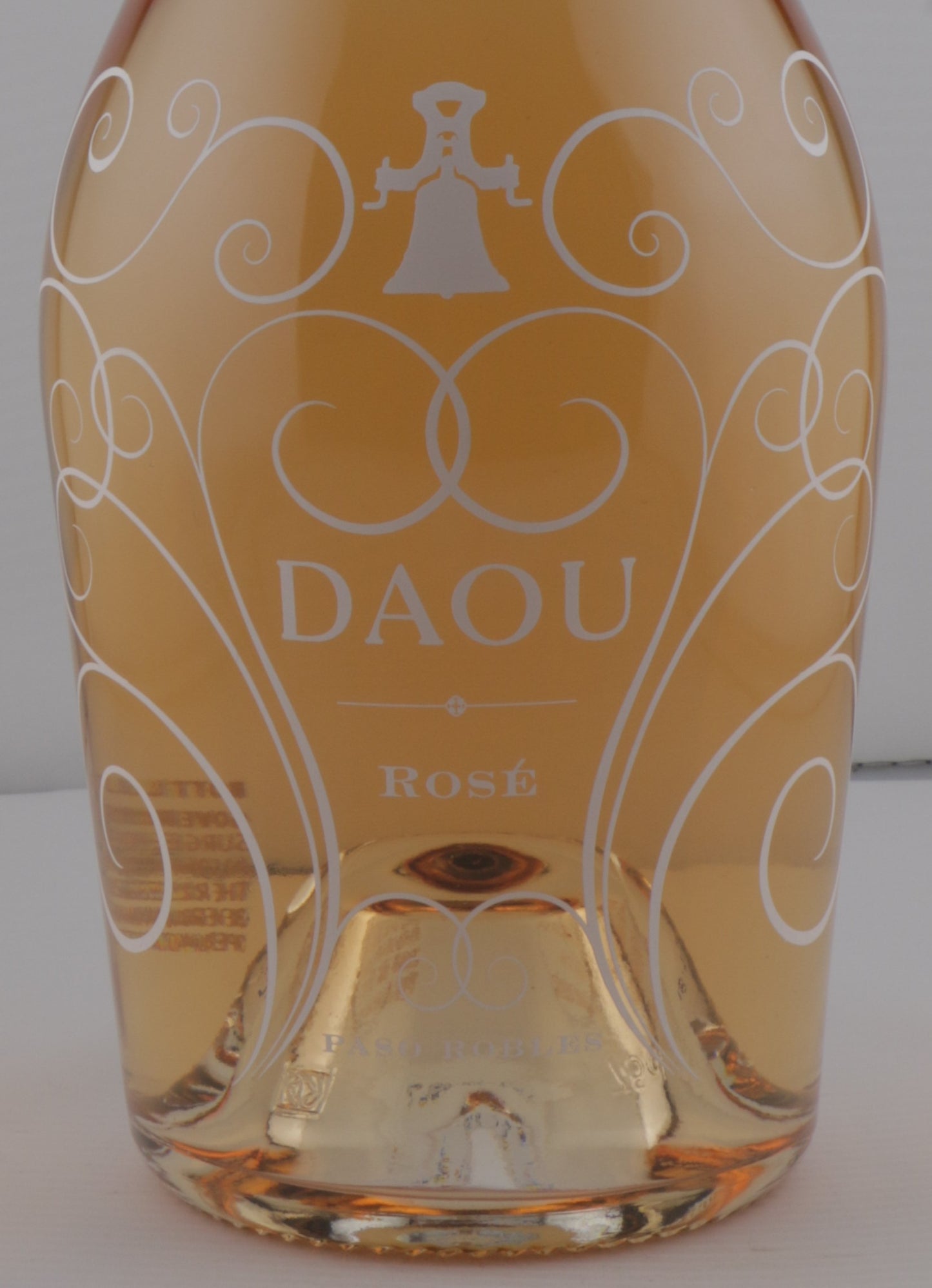 DAOU Rosé wine bottle with decorative label on a white background