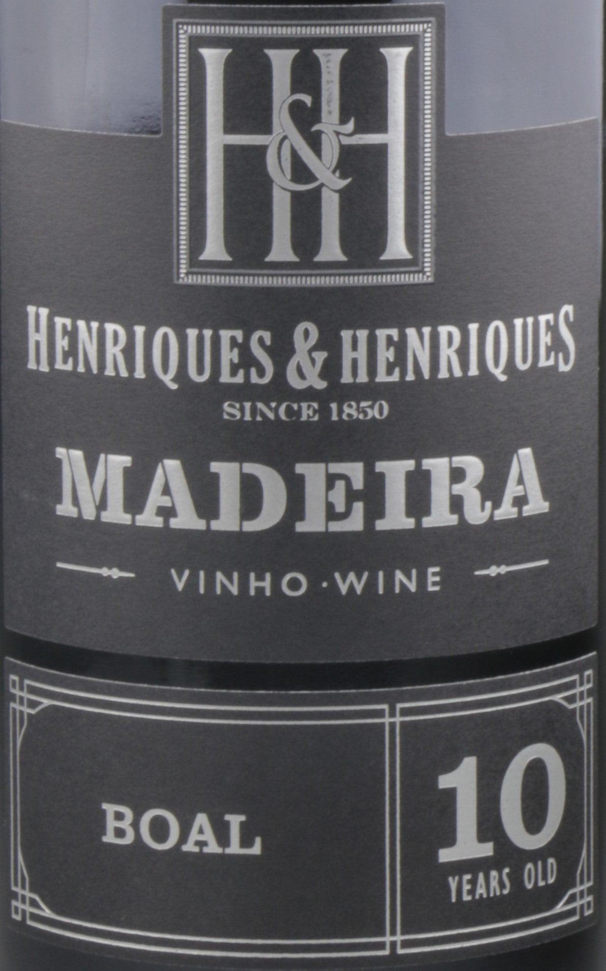 Henriques vineyard showcasing the finest Madeira wine bottles, a true taste of Madeira's rich wine tradition.