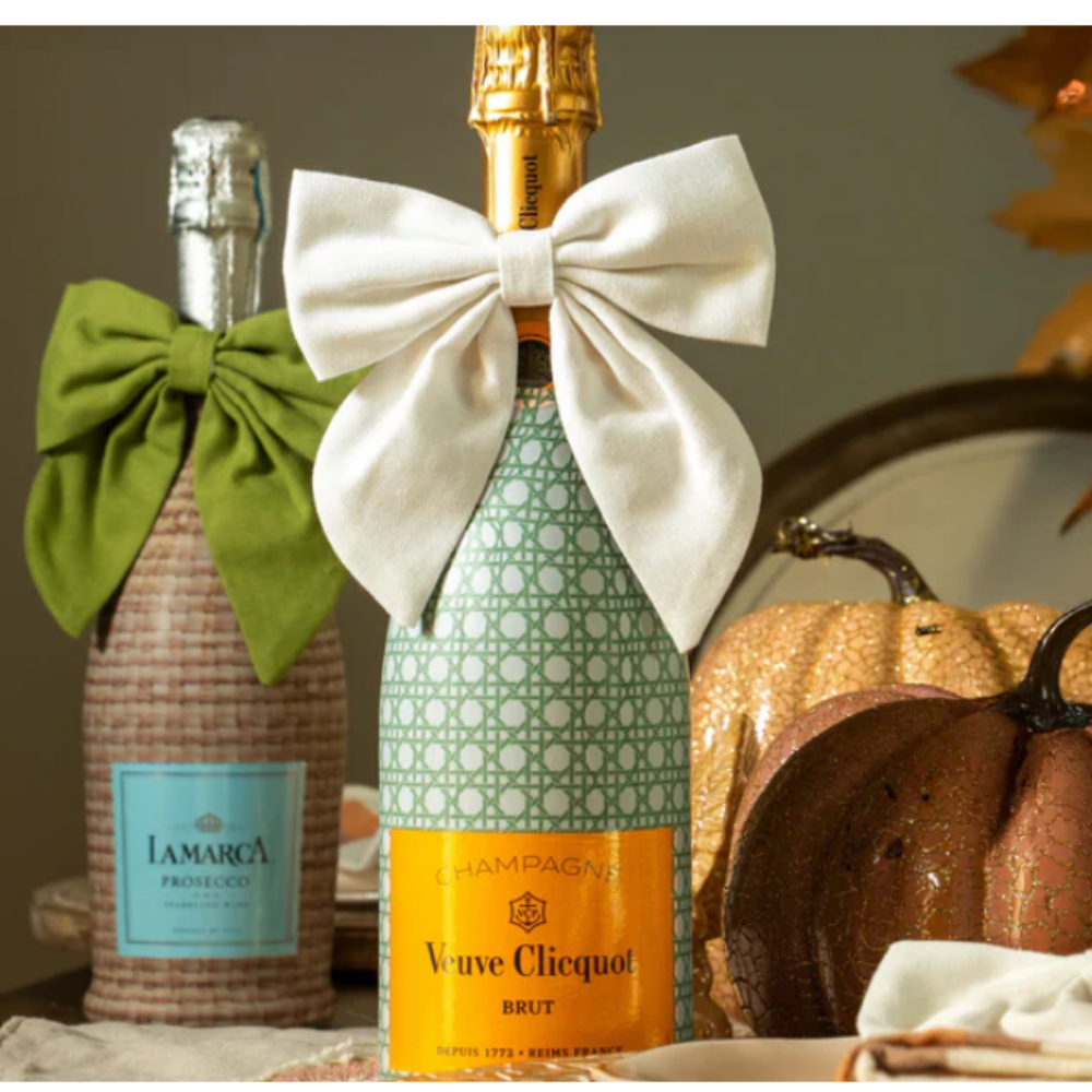 Sparkling wine bottles with a pretty bottle wrap from beau bottles