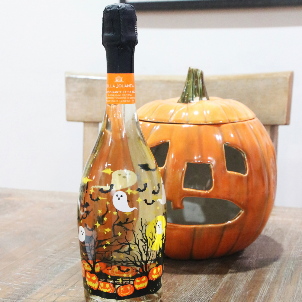 Halloween Sparkling wine with an orange ceramic pumpkin 