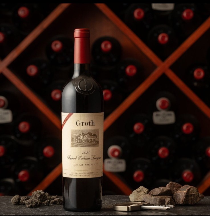 Groth Oakville Cabernet in front of a wine rack