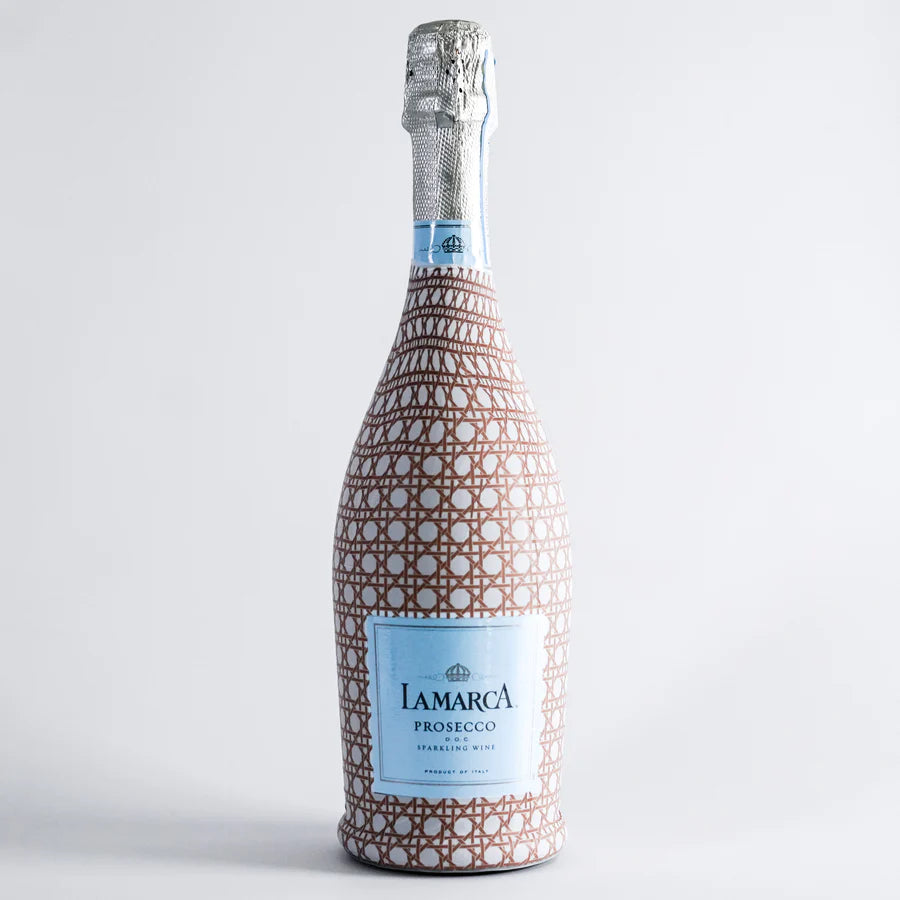Bottle of Lamarca Prosecco with decorative label on a light gray background
