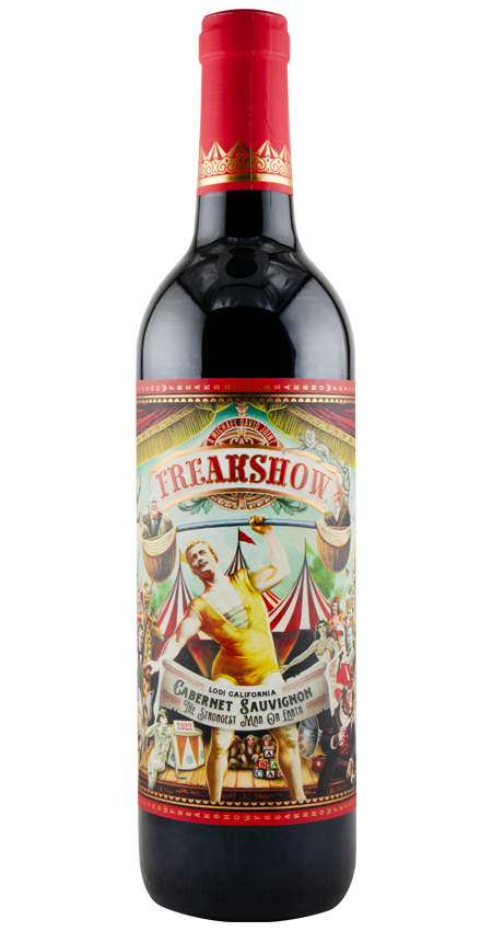 Wine bottle with a colorful label featuring circus-themed graphics on a white background