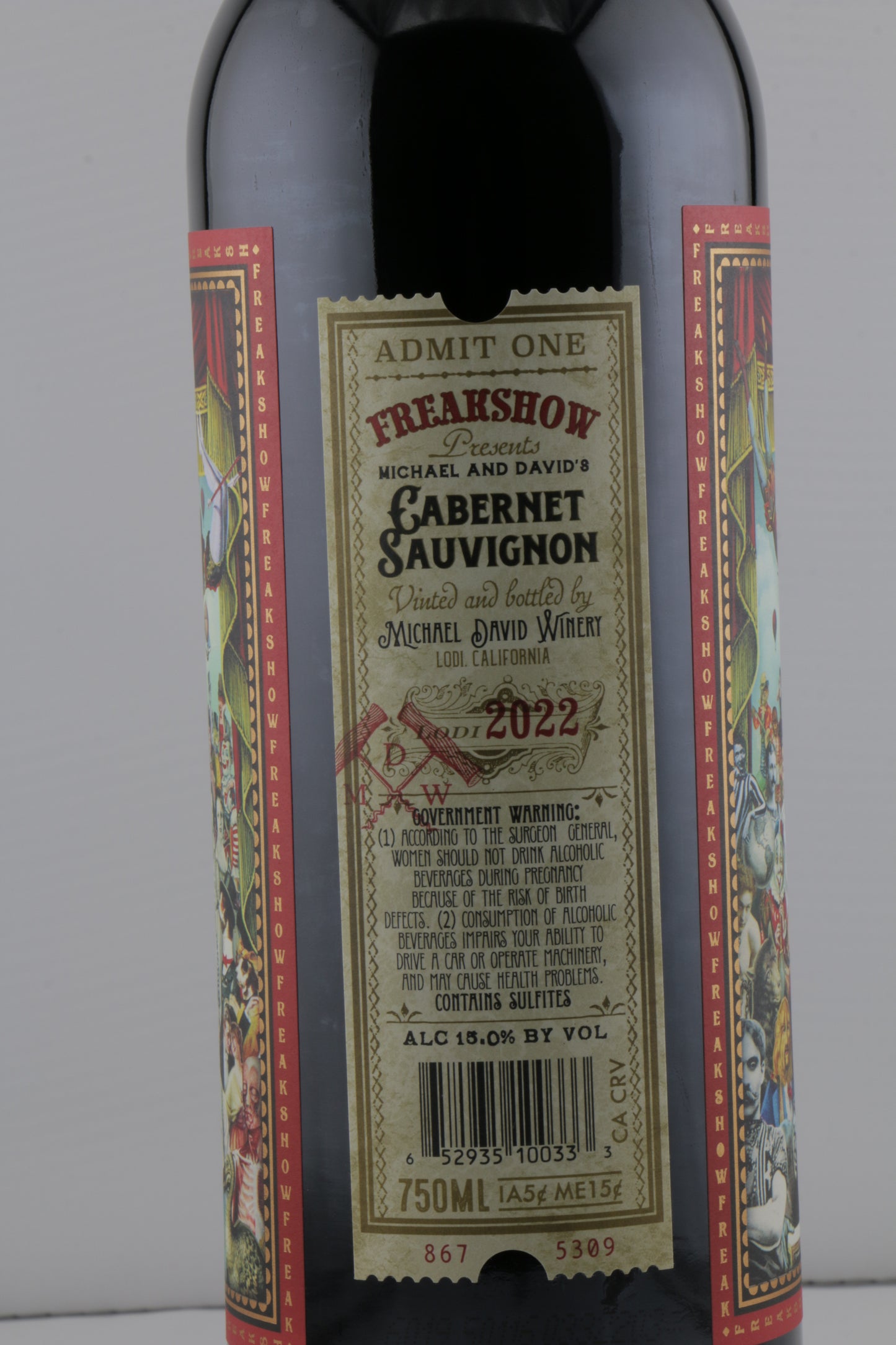 Wine bottle with decorative label on a gray background