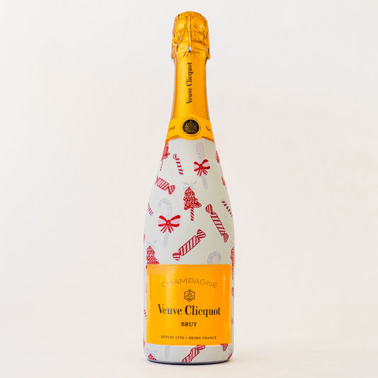Veuve Clicquot champagne bottle with festive candy cane design on a white background