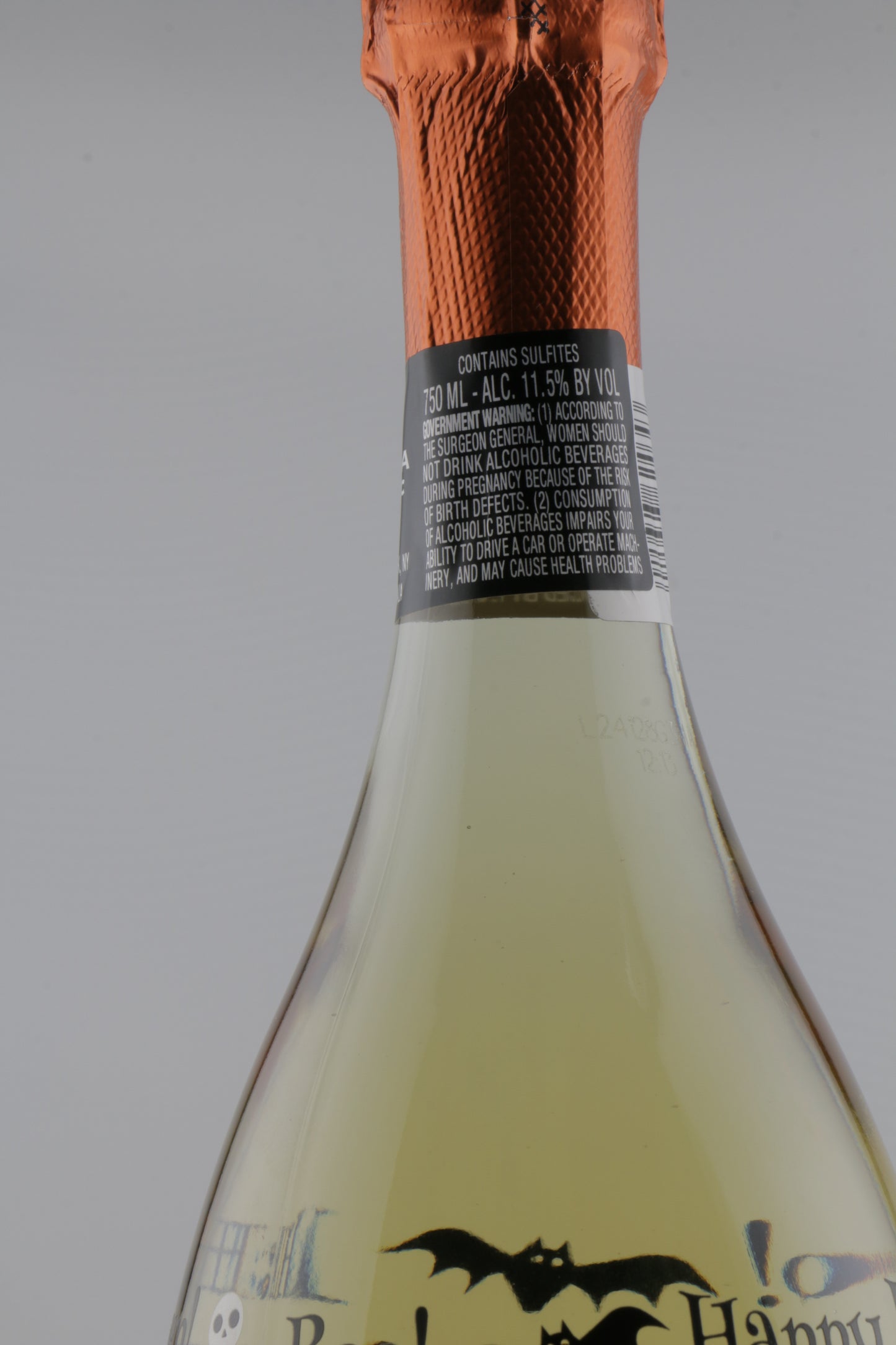 Close-up of a bottle with a label, showing a brand logo on a gray background